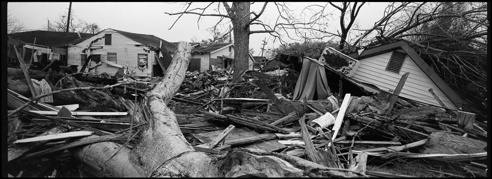 lower 9th ward after hurricane katrina - panoramic of tree and destroyed houses