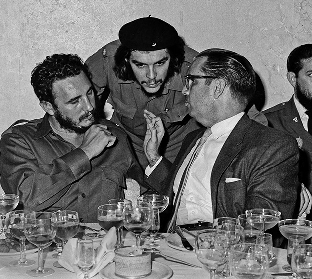 Cuban revolutionary hero Ernesto "Che" Guevara, center, Cuban leader Fidel Castro, left, and Cuban President Osvaldo Dorticos, right, attend a reception at an undisclosed location in Cuba, 1960.