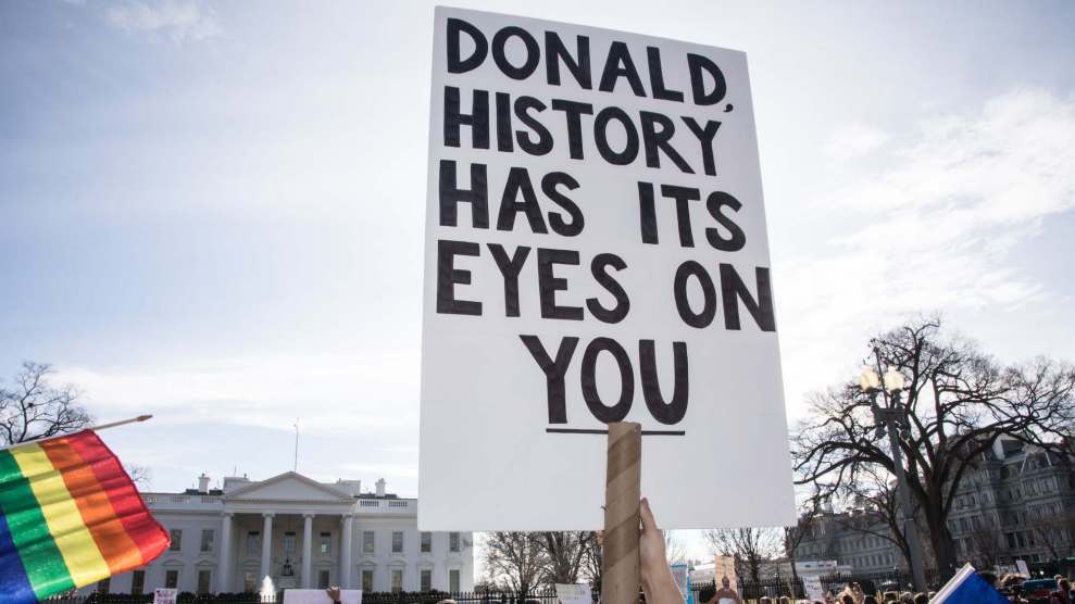 A sign reads "Donald, history has its eyes on you"