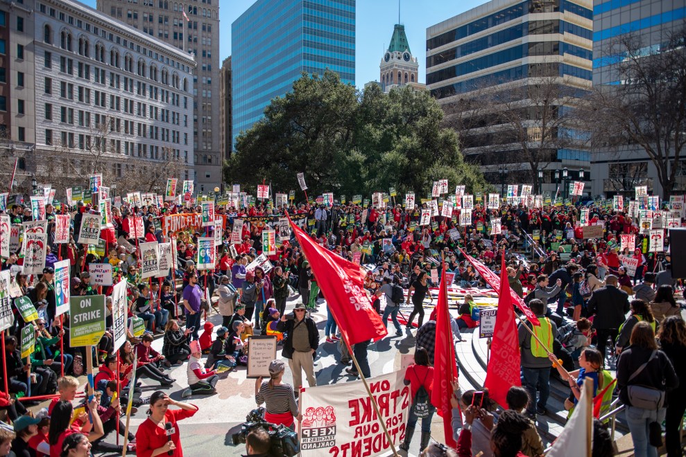 Hundreds of teachers, students, and supporters rally in downtown Oakland, Calif., on the first day of a district-wide teacher strike.