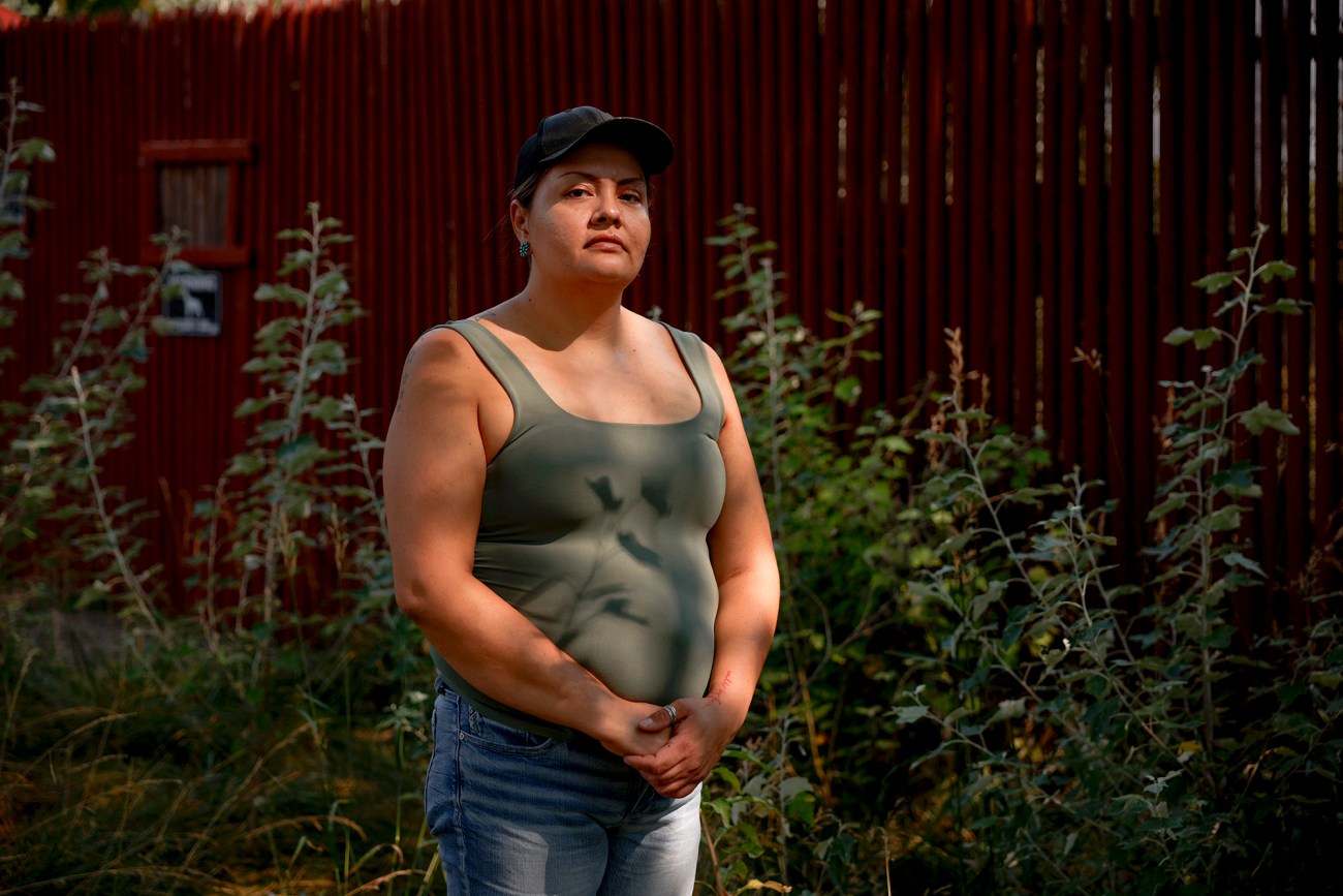 Portrait of a woman standing outside.