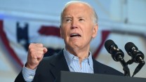 Biden speaks at a podium, his fist in the air