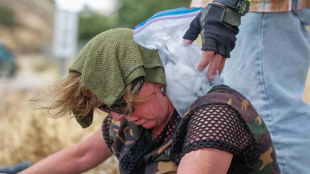 Woman cools down with an ice pack