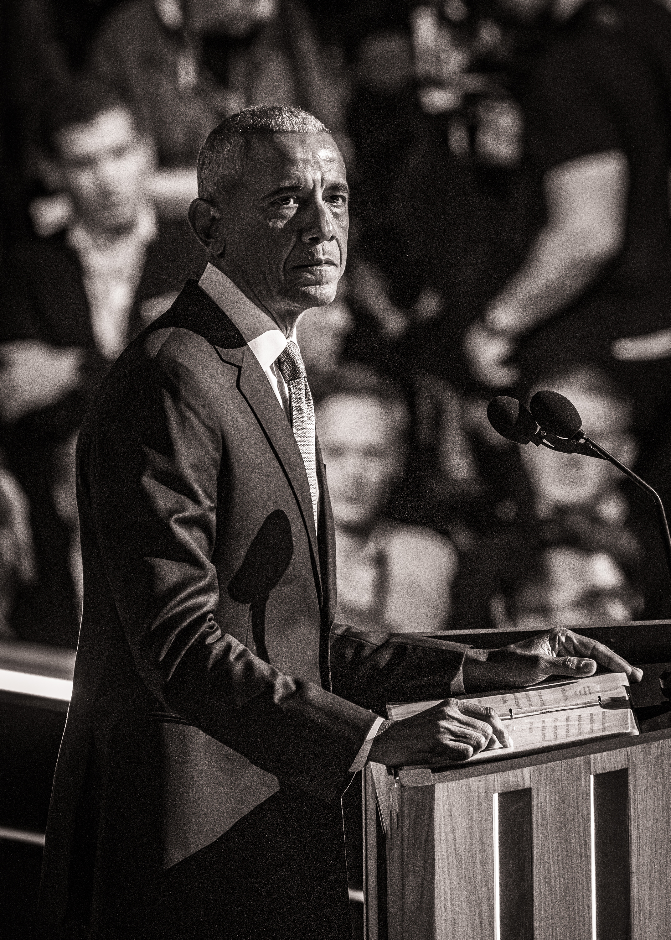 Black and white photo of Barack Obama speaking at a lecturn.