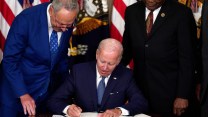 Joe Biden signs the Inflation Reduction Act into law