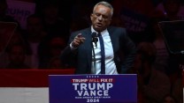 Robert Kennedy Jr. speaking behind a podium reading "Trump will fix it; Trump Vance 2024"