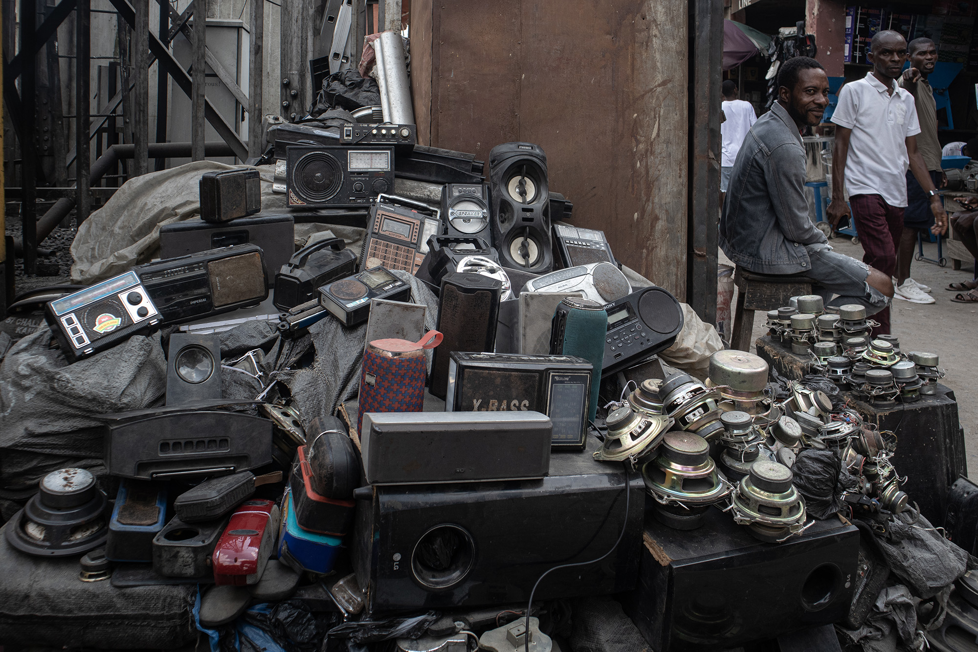 A pile of speakers and old radios.