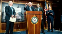 Bernie Sanders behind a podium.