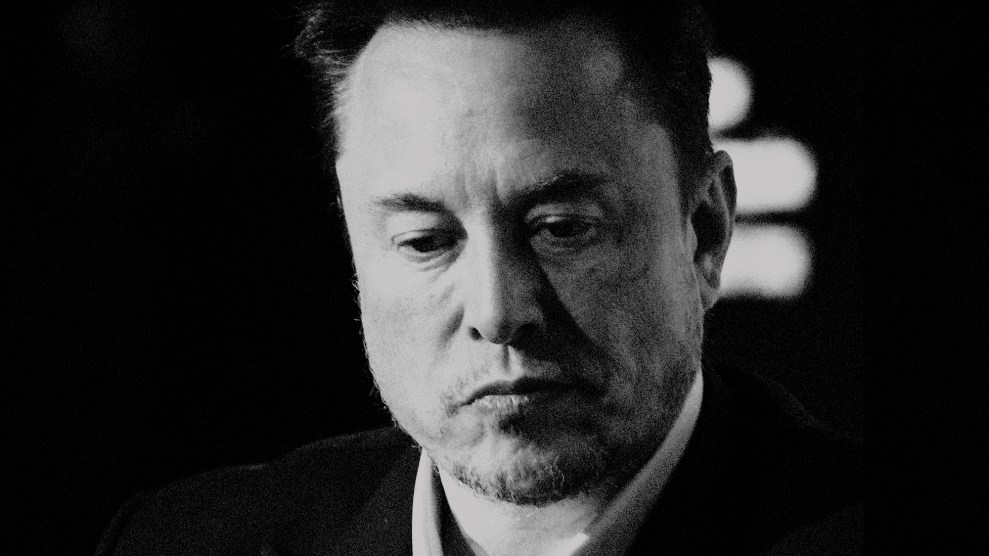 Black and white portrait of Elon Musk; his gaze is downturn and his mouth is downturned.