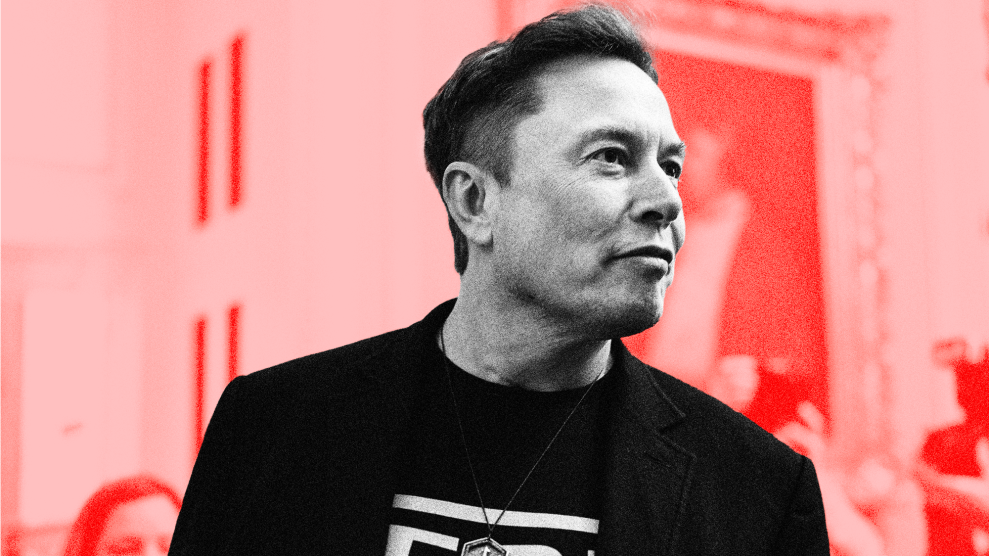 A photo illustration of Elon Musk, pictured in black-and-white, against a background in shades of red. In this image, he is seen from the chest up looking to our right in the halls of the US Capitol. He's wearing a black blazer and black t-shirt with a white design. The background of the photo reveals an out-of-focus historical painted portrait.