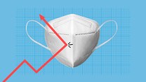 Photo illustration of a rising arrow on a graph running into a KN95 mask and being deflected in the opposite direction.