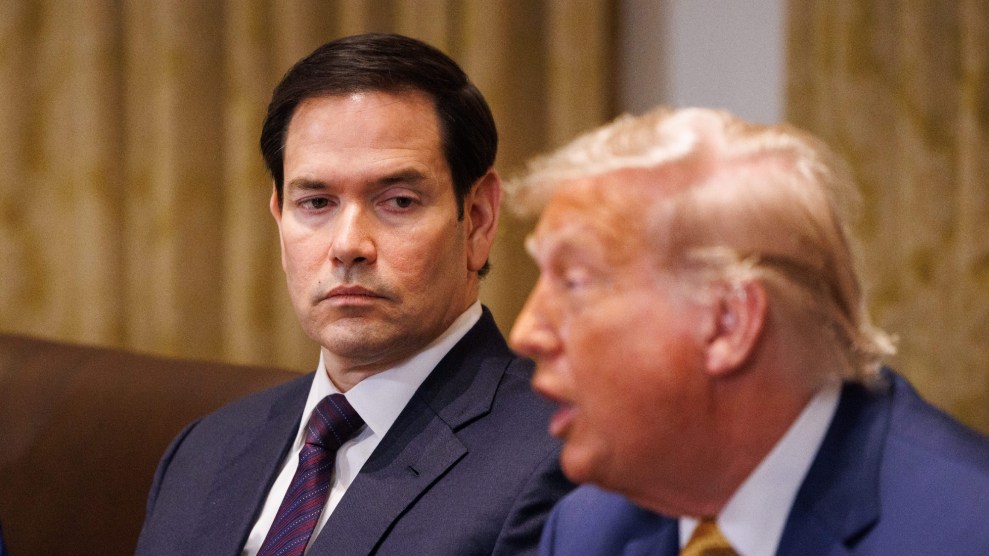 Marco Rubio looks at a talking Donald Trump during a meeting in the White House cabinet room.