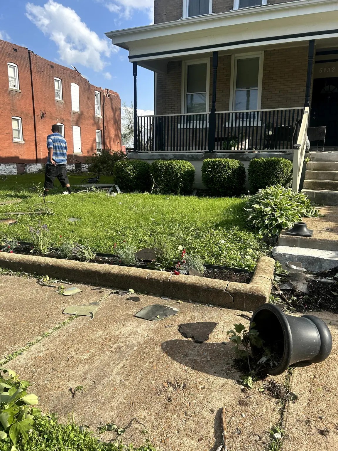 Broken glass and debris on the front lawn