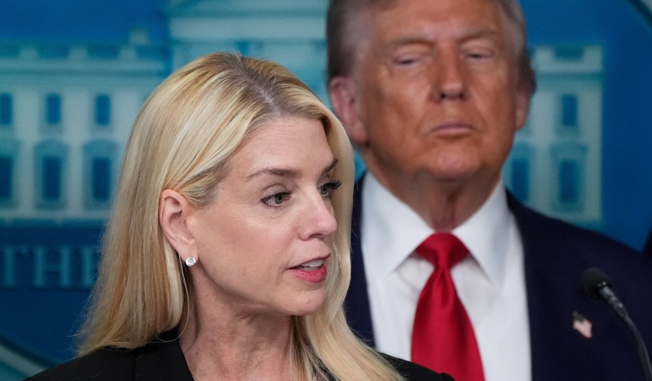 Trump lookin at Pam Bondi from the briefing room.