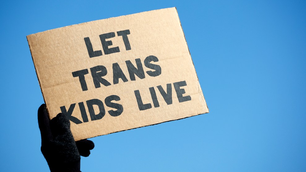 A sign that says "let trans kids live"