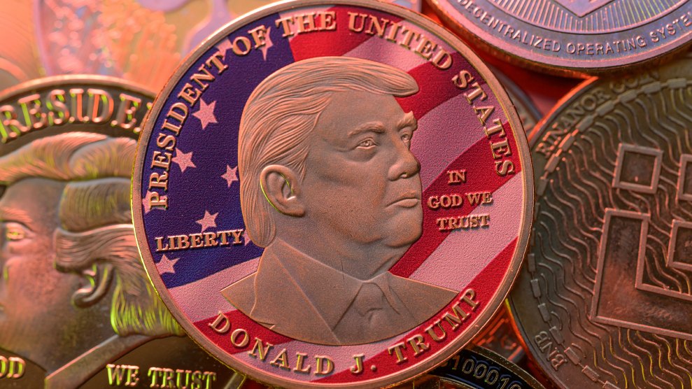 A pile of Trump meme coins featuring one gold coin with his visage and an American flag background