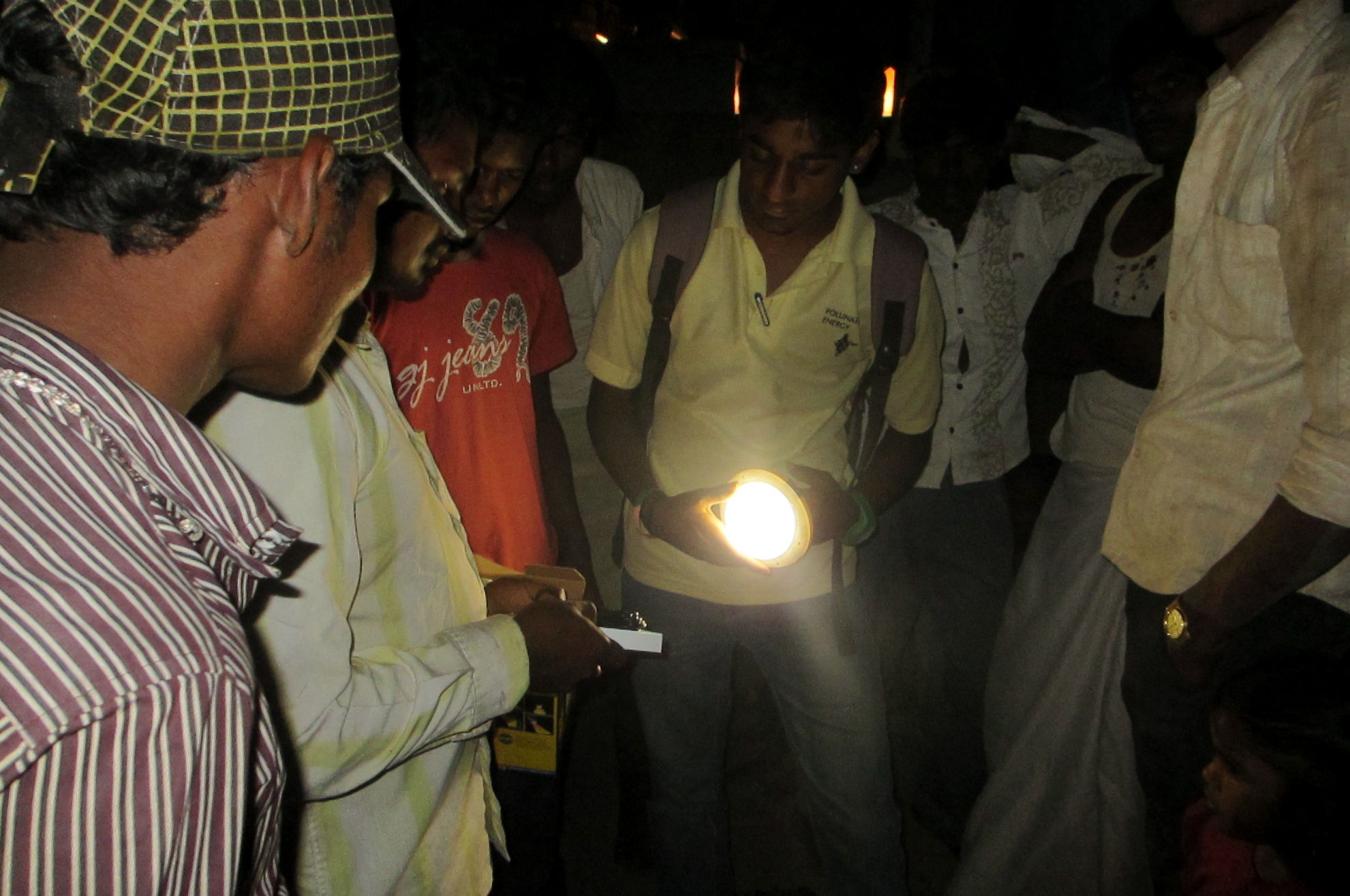 People holding a solar light