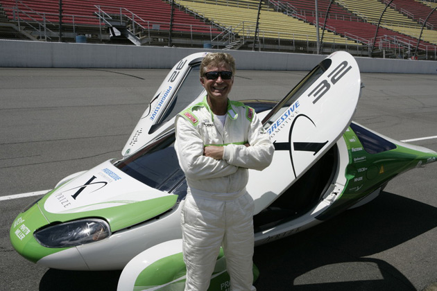 A team member with one of Edison2's Very Light Cars.